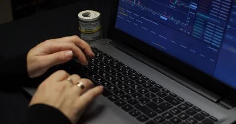 Laptop keyboard with cryptocurrency graph on screen Analysis of the Stock Photos