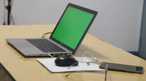 Laptop keyboard, notebook,  glasses, computer mouse and mobile phone on  of.. Stock Photos