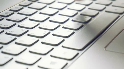 Laptop keyboard typing. Close up shot of hands touch typing on a laptop keyboard Stock Footage 87377518