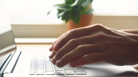 Laptop keyboard typing. Close up shot of hands touch typing on a laptop keyboard Stock Footage 87377872