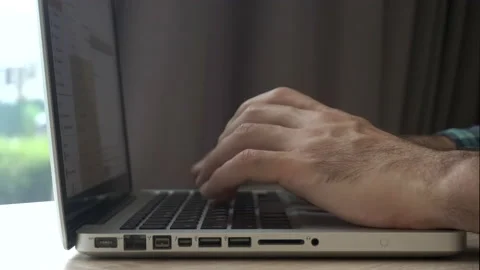 Laptop keyboard. Working at a computer keyboard in the office or at home, typing Stock Footage 155696307