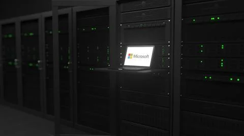 Laptop with the logo of MICROSOFT on the screen in a server room. Conceptual 스톡 일러스트