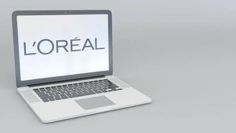 Laptop with L'Oreal logo. Computer technology conceptual editorial 3D rendering Stock Illustration