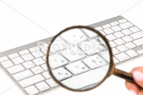 Laptop with a magnifying glass Stock Photos