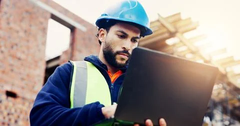 Laptop, man and typing on construction site with communication for building.. Stock Photos