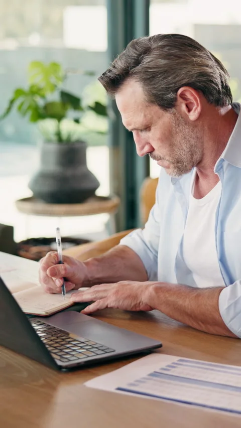 Laptop, man and writing notes for remote work with insurance, research or Stock Footage 346302522