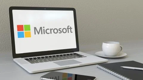 Laptop with Microsoft logo on the screen. Modern workplace conceptual editorial Stock Illustration
