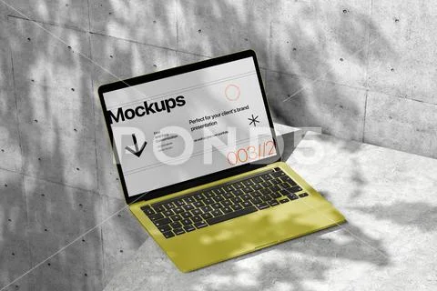 Laptop Mockup on Concrete Surface PSD Template