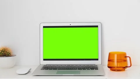 Laptop with mockup green screen on a whi... | Stock Video | Pond5