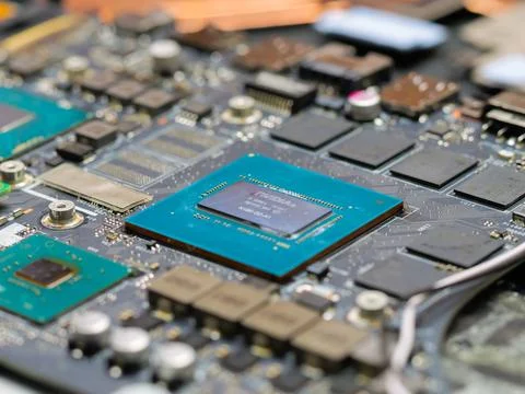 Laptop motherboard featuring an NVIDIA processor, RAM modules, and other co.. Stock Photos