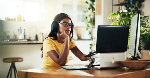 Laptop, music and problem solving with Indian woman in home office for graphic Stock Photos