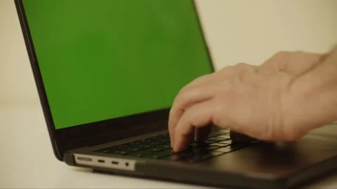 Laptop Notebook 2 hands keyboard typing with green screen 2 left side shot  Vídeo Stock 303592048