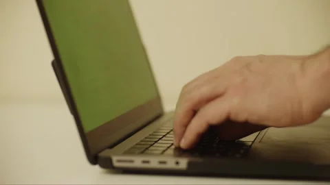 Laptop Notebook 2 hands keyboard typing with green screen 3 left side shot  Video stock 303592073