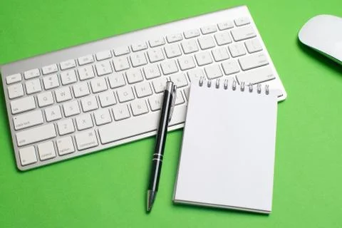 Laptop with notepad and pen Stock Photos