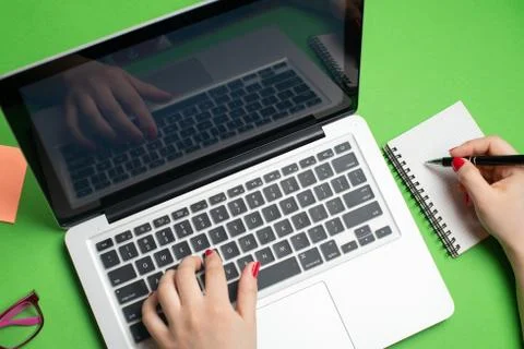Laptop with notepad and pen Stock Photos