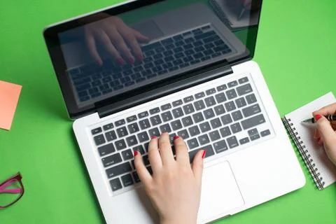 Laptop with notepad and pen Stock Photos