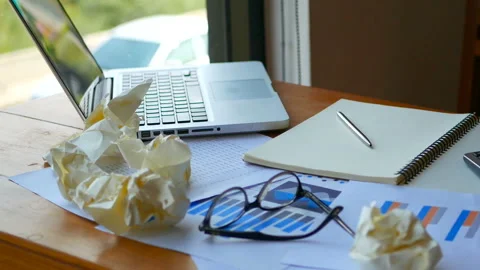 Laptop with paper work as chart and graph account with calculator on table Stock Footage 134031917