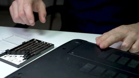Laptop PC Computer Repairment with Micro Screwdriver - 2 Times Slow Motion Stock Footage 129408553