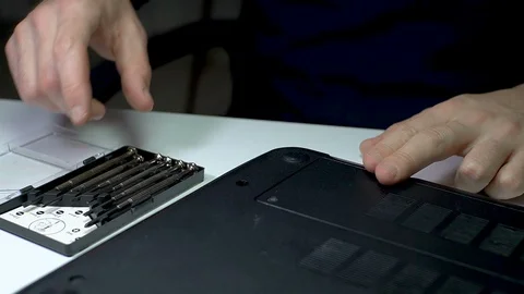 Laptop PC Computer Repairment with Micro Screwdriver - 2 Times Slow Motion Stock Footage 129841034