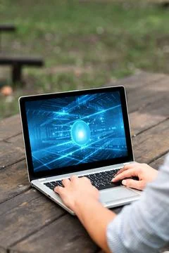 Laptop Placed Resting On Table Working In The Park Actively Accomplishing R.. Stock Photos