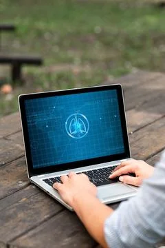 Laptop Placed Resting On Table Working In The Park Actively Accomplishing R.. Stock Photos