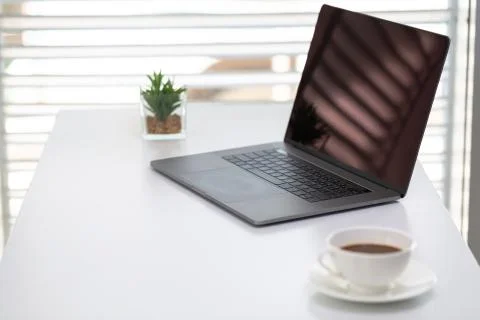 The laptop is placed on the work desk. Working in the office. Foto stock