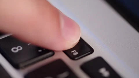 Laptop play and pause key close up. Pressing the play pause media control b.. Stock Footage 340958522