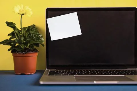 Laptop with post it note opened lid Stock Photos