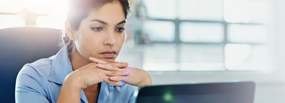 Laptop, problem solving and thinking with business woman in office for investing Stock Photos