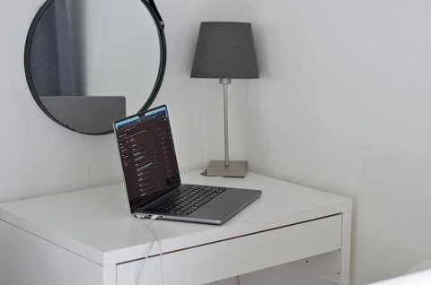 Laptop reflected in the mirror Stock Photos