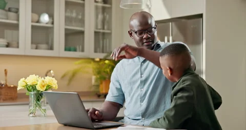Laptop, remote work and dad with child in kitchen, multitasking and man with son Stock Footage 341554485