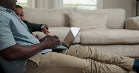Laptop, remote work and dad with child in lounge, copywriting and explaining Stock Footage 341661007
