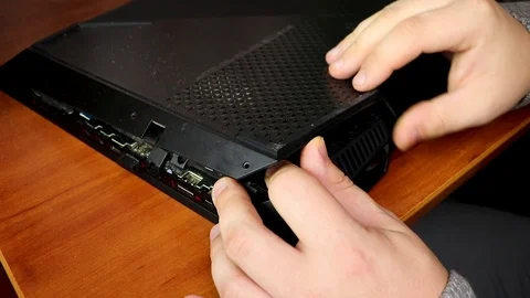 Laptop, removed the back cover, visible chips and the hand of a master. The conc Stock Footage 99108360