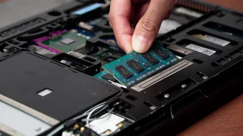 Laptop repair engineer (PC computer) and motherboard install DDR RAM memory in c Stock Footage 148615270