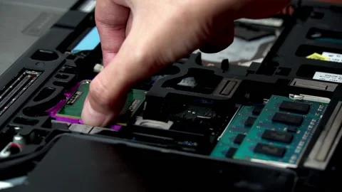 Laptop repair engineer (PC computer) and motherboard install CPU in computer lab Stock Footage 148615317