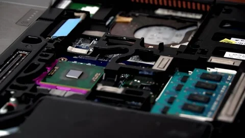 Laptop repair engineer (PC computer) and remove the CPU from the motherboard. In Stock Footage 148615319