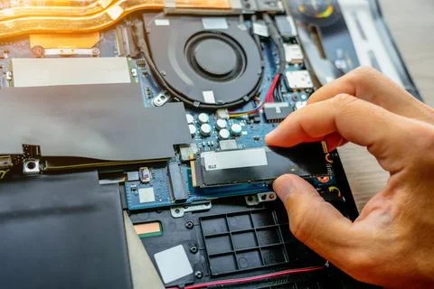 Laptop repair engineer PC computer and motherboard install random access memo Stock Photos