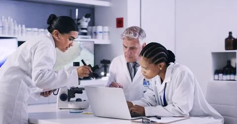 Laptop, research and team of scientists in laboratory for medical study, br.. Stock Photos