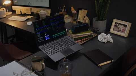 Laptop Running Data Analytics Code on Desk in Late Night Office Stock Footage 338414084