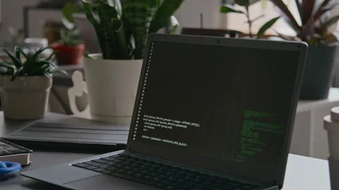 Laptop with Running Programming Code on Desk at IT Startup Stock Footage 285713525
