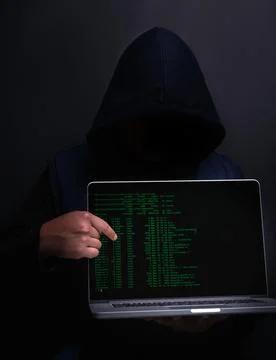 Laptop, screen and hacker with database in studio for cybersecurity, ransomware Foto stock