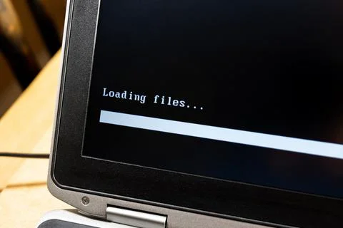 Laptop screen, computer display closeup, loading files progress bar, waiting  Stock Photos