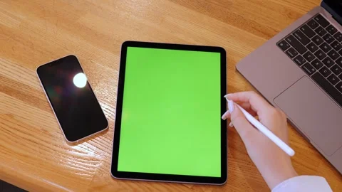 Laptop screen green, placed on table Stock Footage 319762312