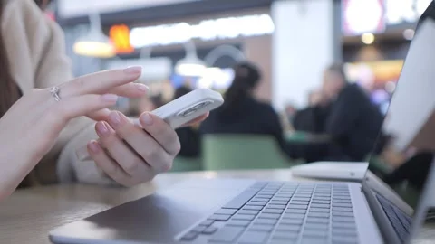 Laptop screen green, on table, cafe blurred background Stock Footage 339469913