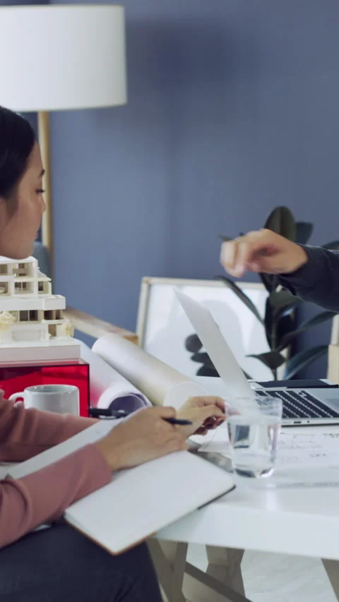Laptop screen, model and notebook with architect people in office together for Stock Footage 329837852