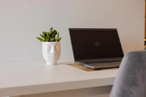 Laptop setup to work from home. Programming and coding. Phone and wireless Stock-Fotos