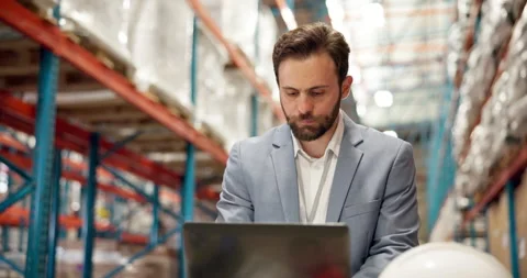 Laptop, shipping and documents with man in warehouse for delivery information, Stock Footage 318565962