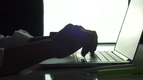 Laptop with silhoutte hands Stock Footage 68890585