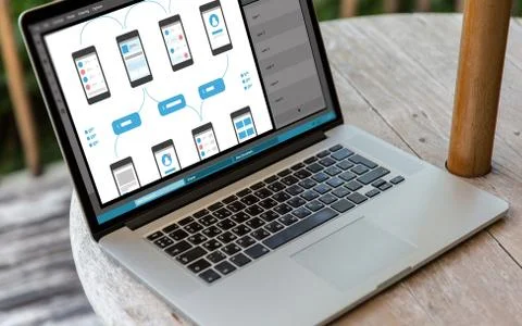 Laptop with smartphone interface design on screen 스톡 사진