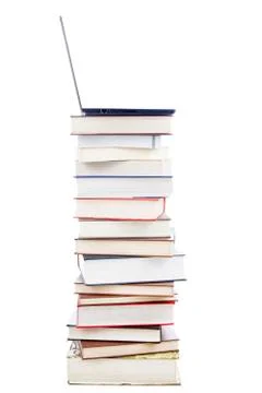 Laptop on stack of books Foto stock